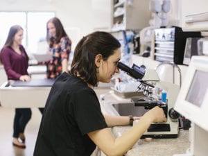veterinary-technicain-looking-at-veterinary-tests veterinary-technicain-looking-at-veterinary-tests