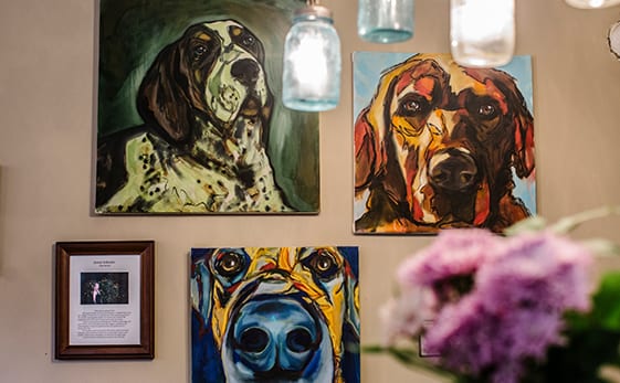 dog paintings on wall